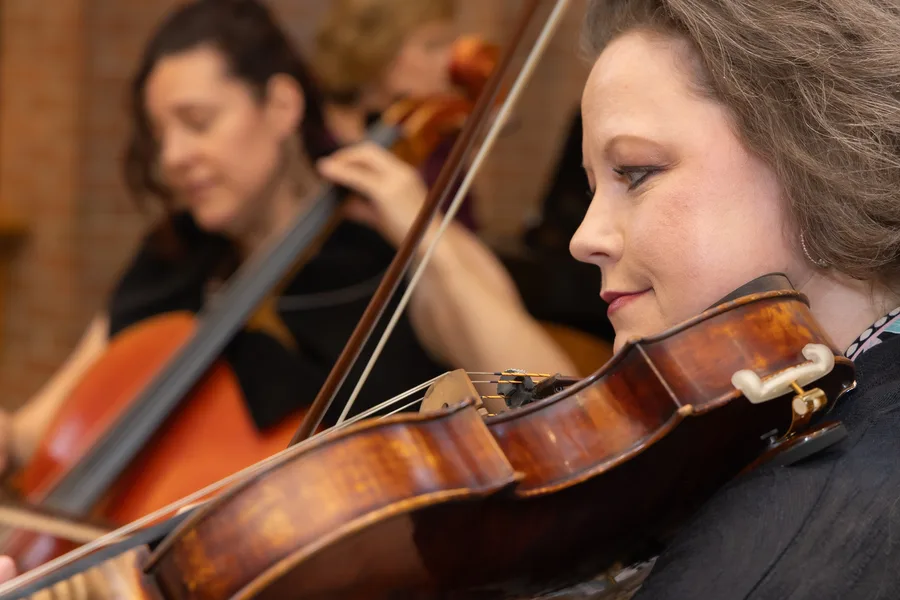 A violist and cellist playing side by side