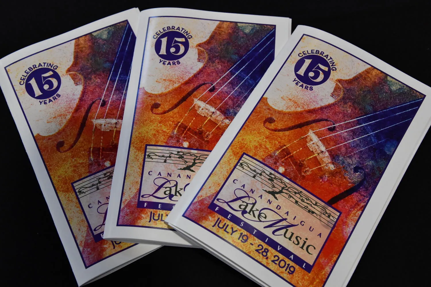 Three festival programs printed “Celebrating 15 Years” and “Canandaigua LakeMusic Festival, July 19 - 28, 2019”