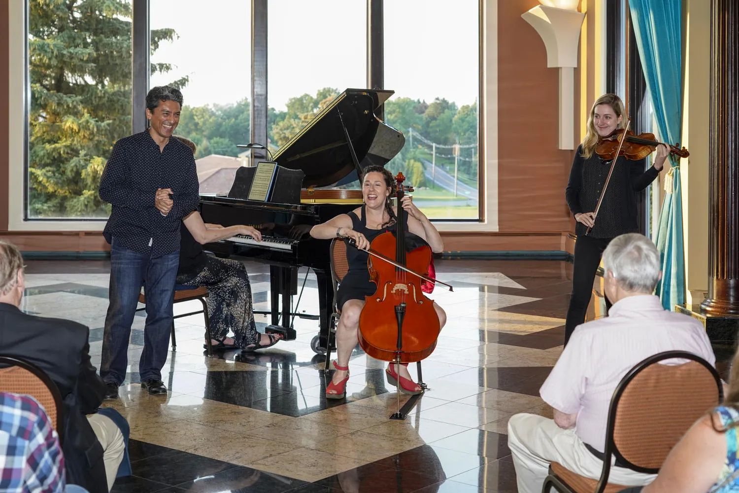 A trio performing for guests