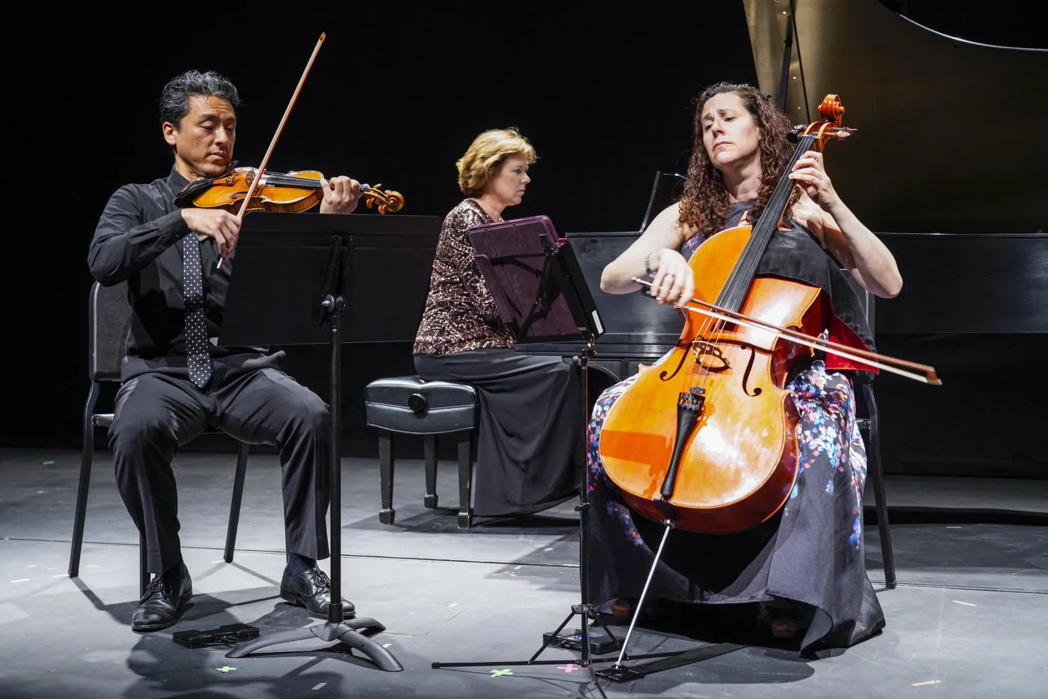 A violinist, pianist and cellist on stage at The Stars Align