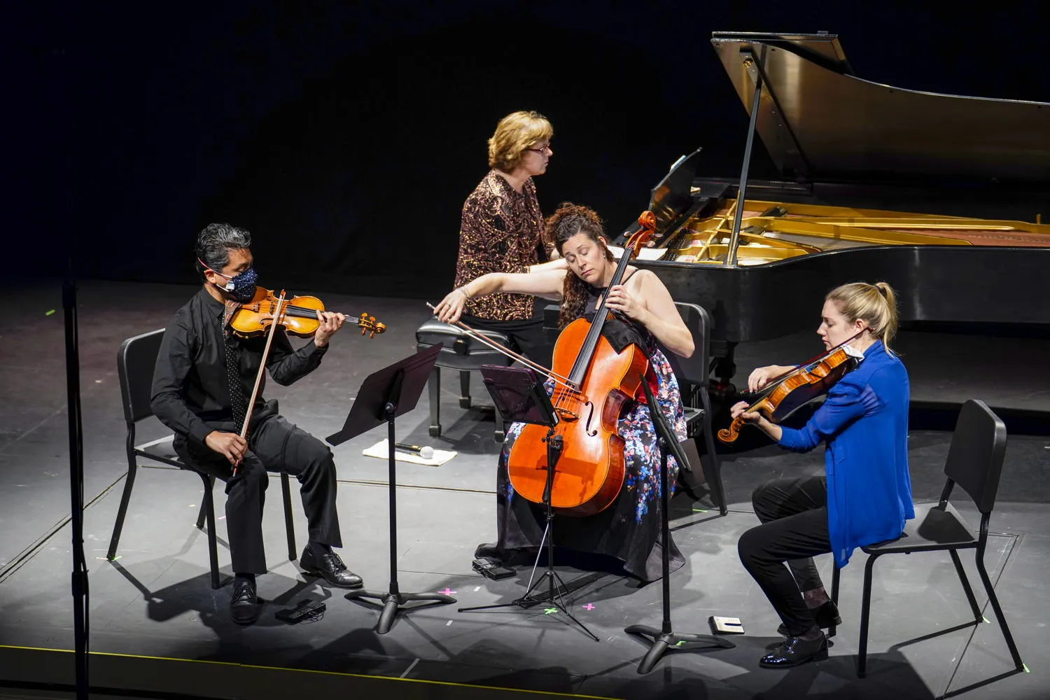 Strings and piano under stage lights