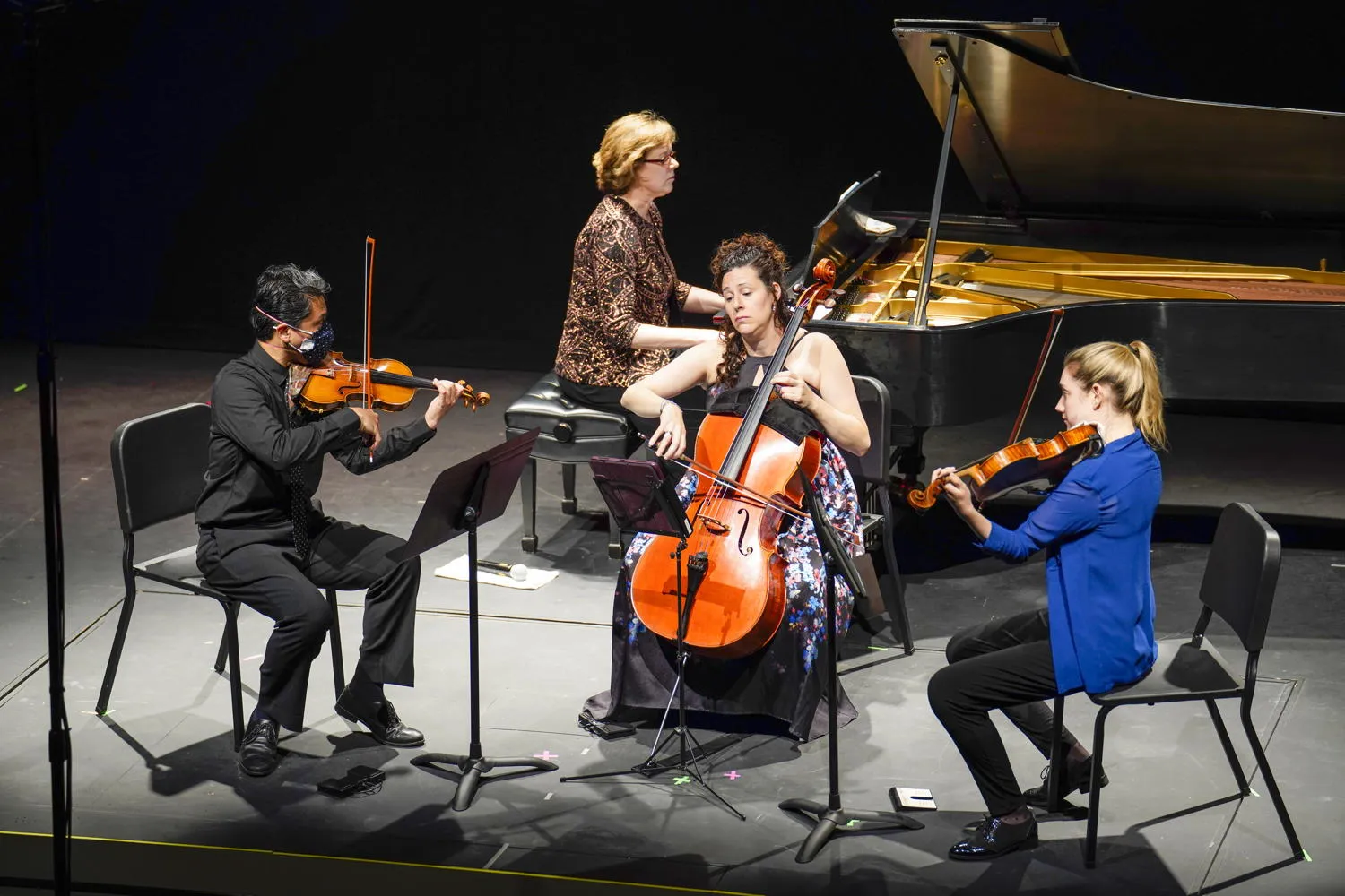 A piano quartet on stage