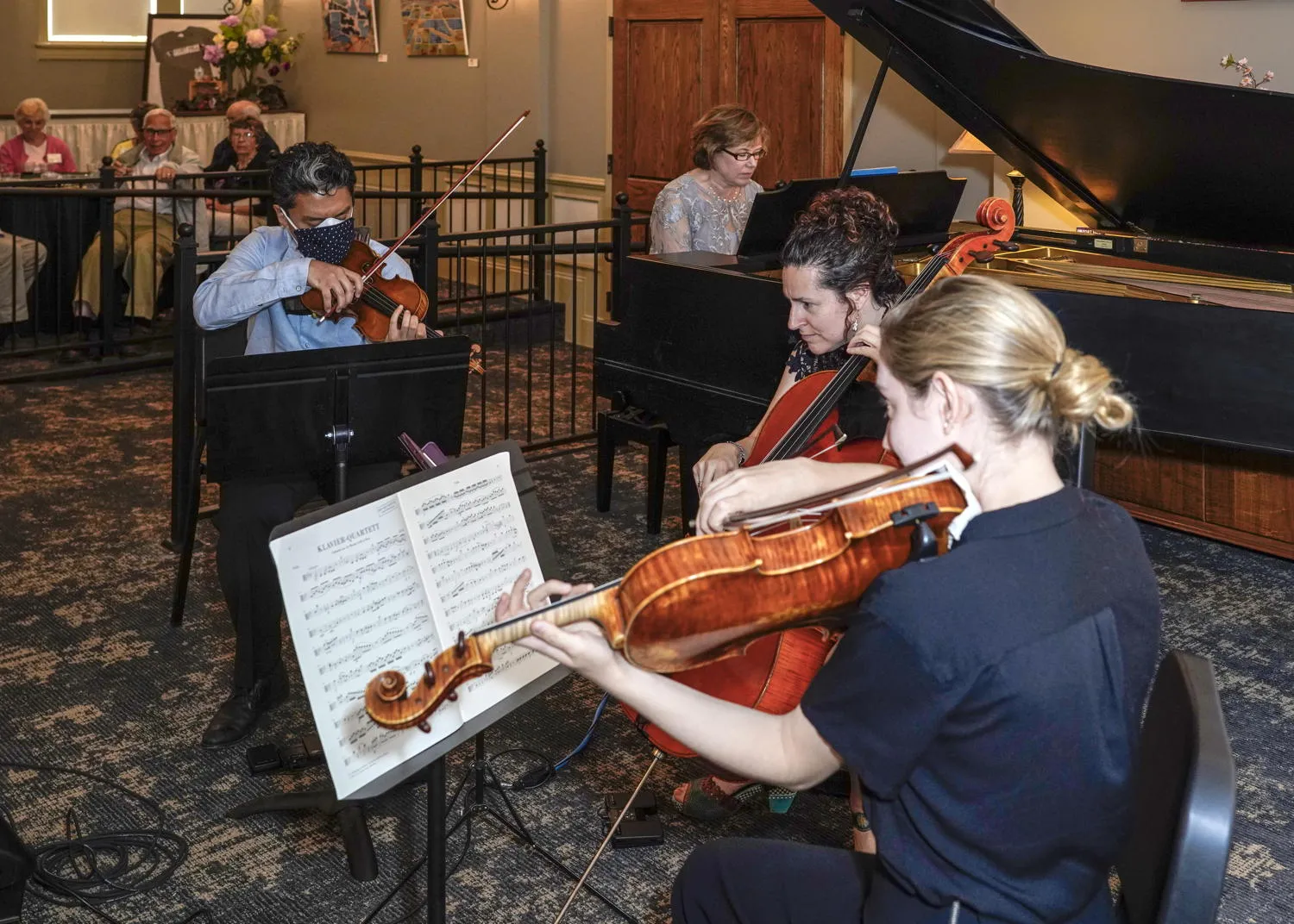 Violinists reading from the stand