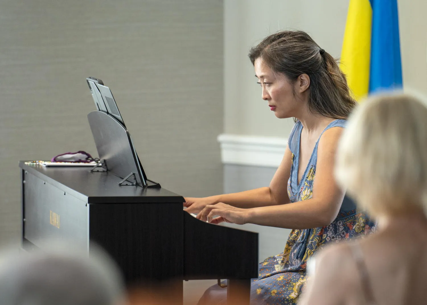 A pianist playing a digital piano