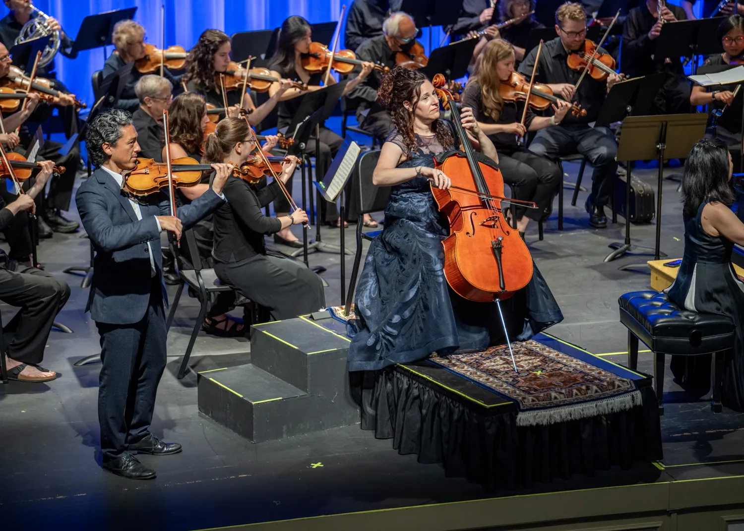 Kevin Kumar and Amy Sue Barston as soloists in front of the orchestra