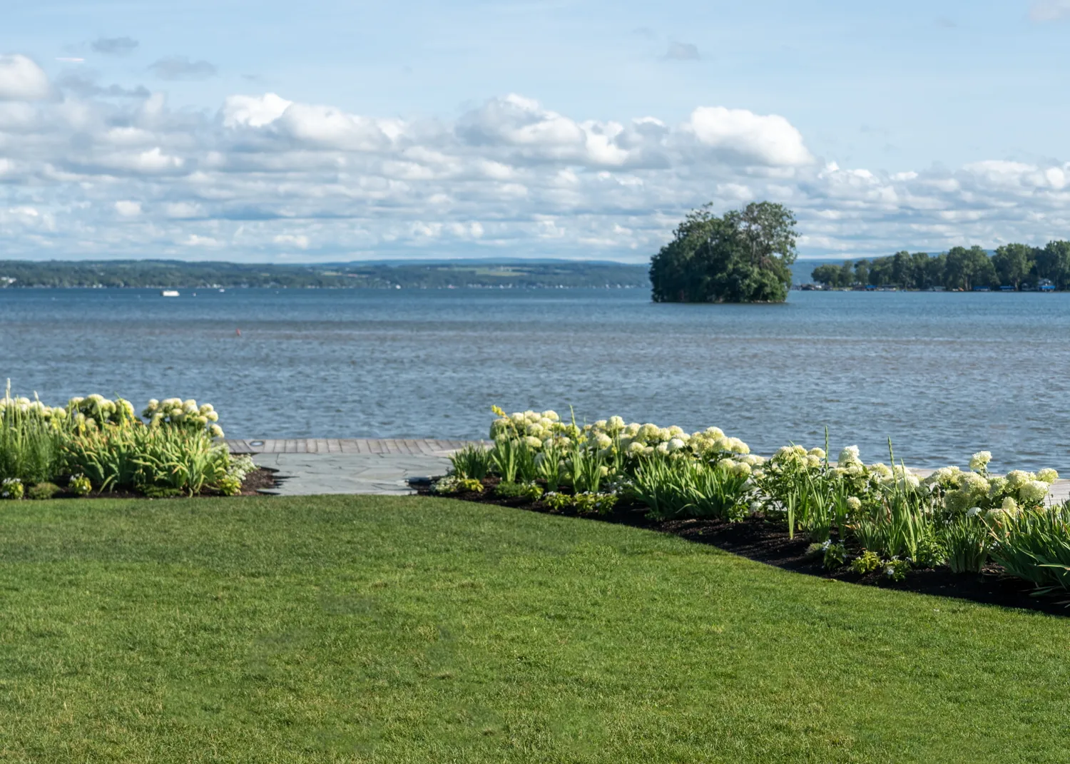 The lake and its small island seen from The Lake House lawn