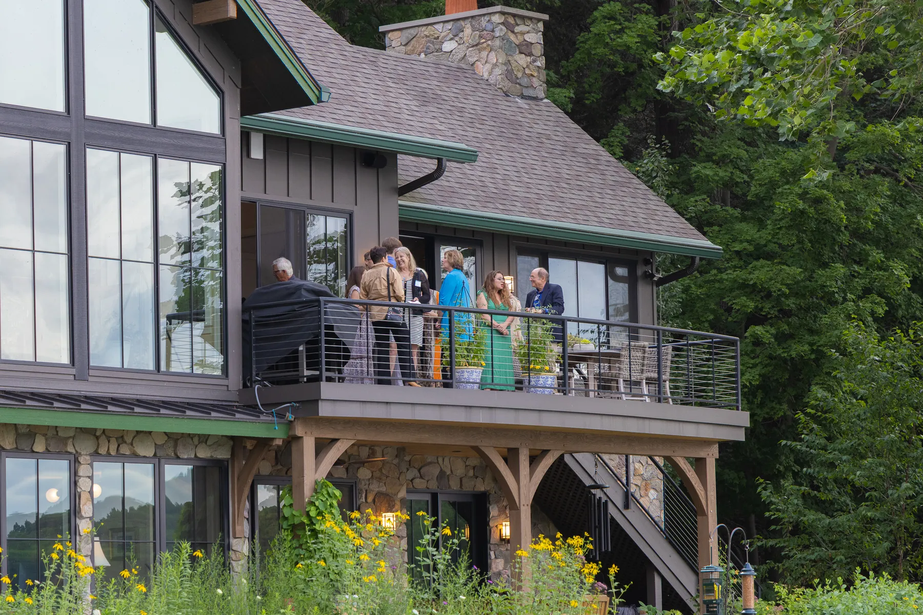 Guests on the deck of the Reading Party host home